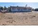 Cozy one-story house on a desert lot, with a small yard, and minimal landscaping at 3748 Skyline St, Logandale, NV 89021