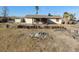 Back of house view showing a partially covered patio at 3748 Skyline St, Logandale, NV 89021