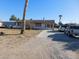 Front of house view with a driveway and landscaping at 3748 Skyline St, Logandale, NV 89021