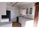 Kitchen with white cabinets, black appliances and a window at 3748 Skyline St, Logandale, NV 89021