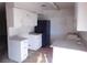 Kitchen with white cabinets and black appliances at 3748 Skyline St, Logandale, NV 89021