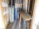 Unfinished utility room with water heater and workbench at 3748 Skyline St, Logandale, NV 89021
