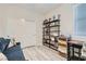 Comfortable bedroom with built-in shelving, and a sofa at 4104 Midnight Crest Ave, North Las Vegas, NV 89031