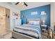 Guest bedroom with blue walls and coastal decor at 4104 Midnight Crest Ave, North Las Vegas, NV 89031