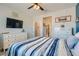 Comfortable bedroom with beach themed decor and large TV at 4104 Midnight Crest Ave, North Las Vegas, NV 89031