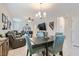 Open dining area with four chairs, near living room at 4104 Midnight Crest Ave, North Las Vegas, NV 89031