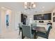 Kitchen dining area with four chairs and chandelier at 4104 Midnight Crest Ave, North Las Vegas, NV 89031