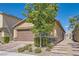 Single-story home with attached garage and landscaped yard at 4104 Midnight Crest Ave, North Las Vegas, NV 89031