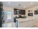 Island kitchen with granite countertops and stainless steel appliances at 4104 Midnight Crest Ave, North Las Vegas, NV 89031