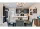 Modern kitchen with granite countertops and dark cabinetry at 4104 Midnight Crest Ave, North Las Vegas, NV 89031