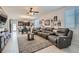Spacious living room with sectional sofa and large TV at 4104 Midnight Crest Ave, North Las Vegas, NV 89031