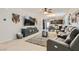 Spacious living room with sectional sofa and large TV at 4104 Midnight Crest Ave, North Las Vegas, NV 89031