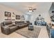 Relaxing living room with sectional sofa and Gathering photos at 4104 Midnight Crest Ave, North Las Vegas, NV 89031