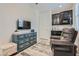 Charming sitting area with built-in cabinetry and a comfortable armchair at 4104 Midnight Crest Ave, North Las Vegas, NV 89031