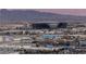 Aerial view showcasing the Allegiant Stadium in Las Vegas against a mountain backdrop at 4381 W Flamingo Rd # 2306, Las Vegas, NV 89103