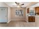 Dining area with tile floor, ceiling fan, and adjacent kitchen at 4872 Nara Vista Way # 101, Las Vegas, NV 89103