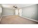 Charming bedroom with gray walls, carpet, and a ceiling fan at 6215 Newville Ave, Las Vegas, NV 89103