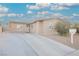 Single-story house with a landscaped yard and driveway at 6215 Newville Ave, Las Vegas, NV 89103