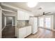 Efficient kitchen, white cabinets, granite counters, and backyard access at 6215 Newville Ave, Las Vegas, NV 89103