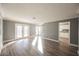 Bright living room with hardwood floors and french doors at 6215 Newville Ave, Las Vegas, NV 89103