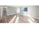Spacious living area with hardwood floors and neutral walls at 6215 Newville Ave, Las Vegas, NV 89103