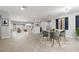 Bright dining room with a round table and grey chairs, features an open floor plan at 6265 N Eula St, Las Vegas, NV 89149