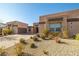 Two-story home with stone accents and desert landscaping at 6265 N Eula St, Las Vegas, NV 89149