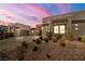 Two-story home with stone accents and desert landscaping at 6265 N Eula St, Las Vegas, NV 89149