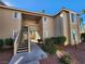 Condo building with stairs and landscaping at 7200 Pirates Cove Rd # 2005, Las Vegas, NV 89145