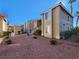 Two story condo building with landscaping and walkway at 7200 Pirates Cove Rd # 2005, Las Vegas, NV 89145