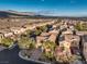 Aerial view of house and neighborhood with mountain views at 7642 Riva Ridge St, Las Vegas, NV 89149