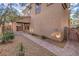 Side yard access with paved pathway and mature trees at 7642 Riva Ridge St, Las Vegas, NV 89149