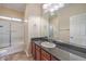 Bathroom with granite countertop, tub, and shower at 7642 Riva Ridge St, Las Vegas, NV 89149