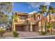 Two story house with attached garage and palm trees at 7642 Riva Ridge St, Las Vegas, NV 89149