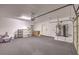 Garage with flooring, shelving, and water heater at 7642 Riva Ridge St, Las Vegas, NV 89149