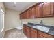 Laundry room with granite countertop and cabinets at 7642 Riva Ridge St, Las Vegas, NV 89149