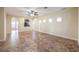 Spacious living room with tile floor and kitchen view at 7642 Riva Ridge St, Las Vegas, NV 89149