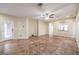 Bright and airy living room featuring tile floors and a view of the kitchen at 7642 Riva Ridge St, Las Vegas, NV 89149