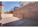 Private backyard with brick pavers and gravel at 826 N Water St, Henderson, NV 89011