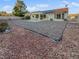 Landscaped backyard with gravel and solar panels at 8509 Goodhaven Dr, Las Vegas, NV 89134