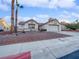Single story home with a two car garage and desert landscaping at 8509 Goodhaven Dr, Las Vegas, NV 89134