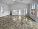 Bright living room featuring tile flooring and large windows at 8509 Goodhaven Dr, Las Vegas, NV 89134