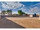 Empty lot with shed and a view of the back of the house at 8645 Edmond St, Las Vegas, NV 89139