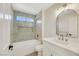 Updated bathroom with a bathtub, modern vanity, and unique tilework at 9524 Sundial Dr, Las Vegas, NV 89134