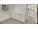 Bright laundry room with white cabinets and vinyl flooring at 9524 Sundial Dr, Las Vegas, NV 89134