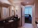Elegant bathroom with a large vanity, soaking tub, and separate shower at , Las Vegas, NV 89109