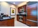 Well-equipped kitchen with wood cabinets and breakfast bar at , Las Vegas, NV 89109
