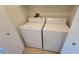 White washer and dryer in a laundry closet at 10512 Beachwalk Pl, Las Vegas, NV 89144