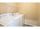 Laundry room with washer, dryer, and shelving at 10516 Blanca Peak Ave, Las Vegas, NV 89129