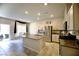 Modern kitchen with island, granite countertops, and stainless steel appliances at 10830 Lexus Ct, Las Vegas, NV 89141